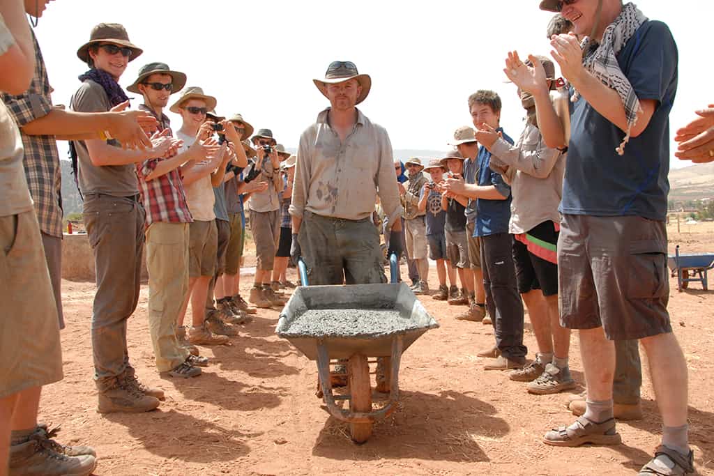 Volunteers help lay the foundations